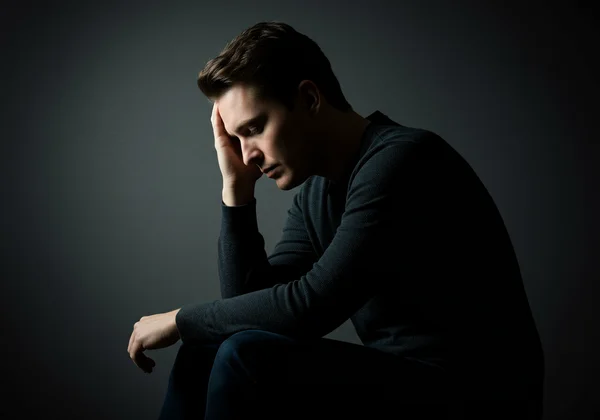 Person showing emotional and physical signs of depression